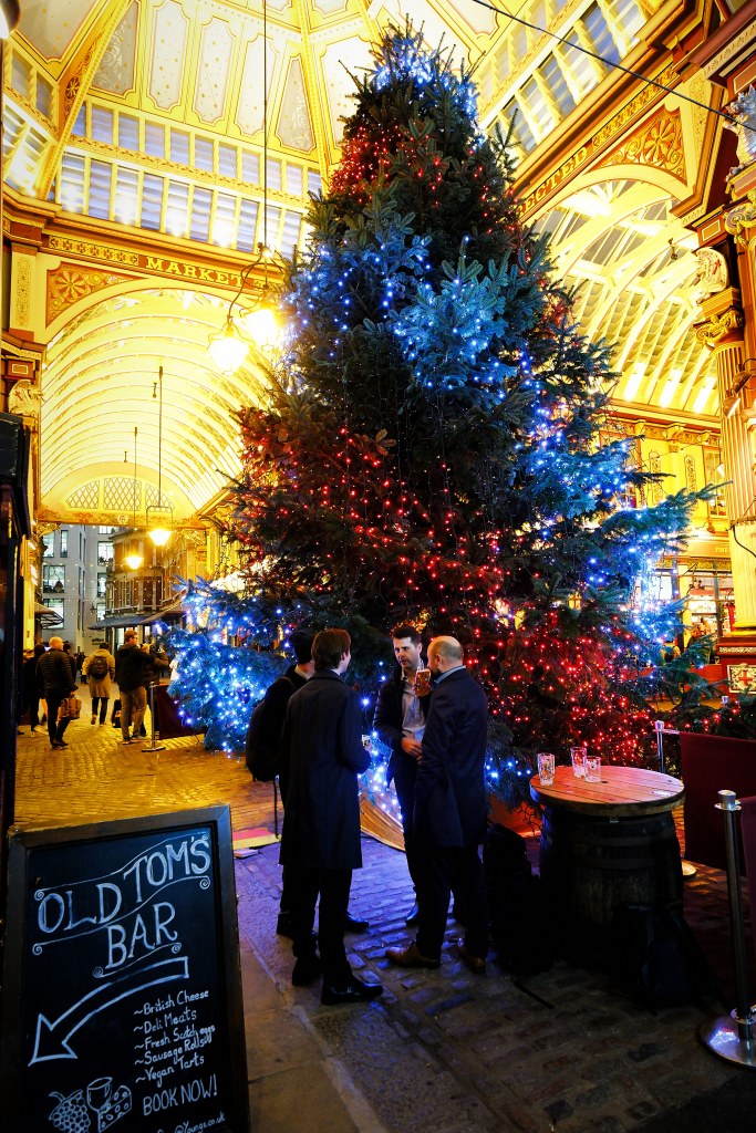 Large Christmas tree decorated with red and blue lights, 