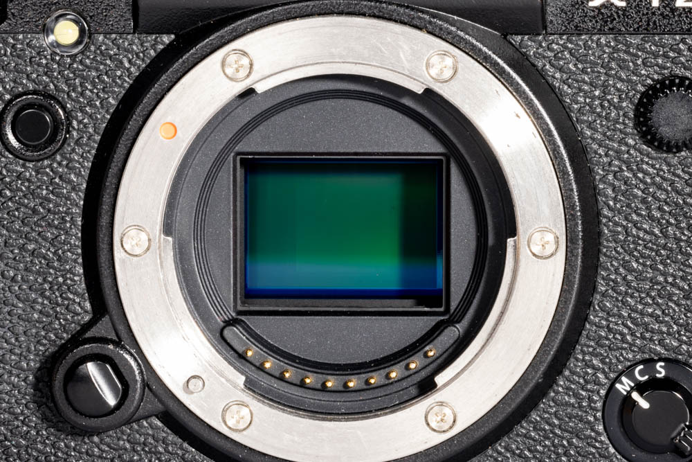 Shows an APS-C sensor in the camera body
