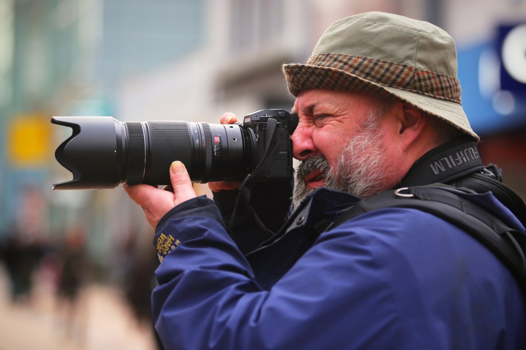 portrait of press Photographer Andy Blackmore with Fujifilm X-H2S mirrorless camera and XF150-600mm F5.6-8 R LM OIS WR lens