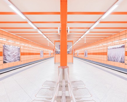 neon orange U-Bahn station in Berlin architecture apoy