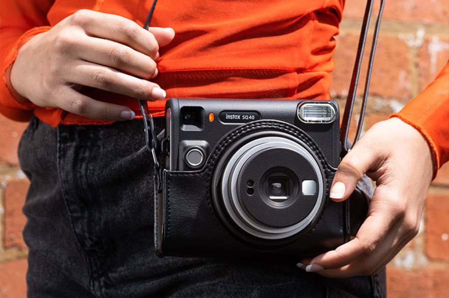 Fujifilm Instax SQ40 released with square format and 'retro' look, photo of the camera on a strap