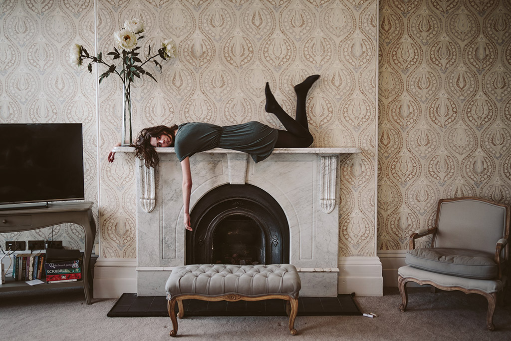 APOY 2023 Portraits Winner woman lying across a fireplace