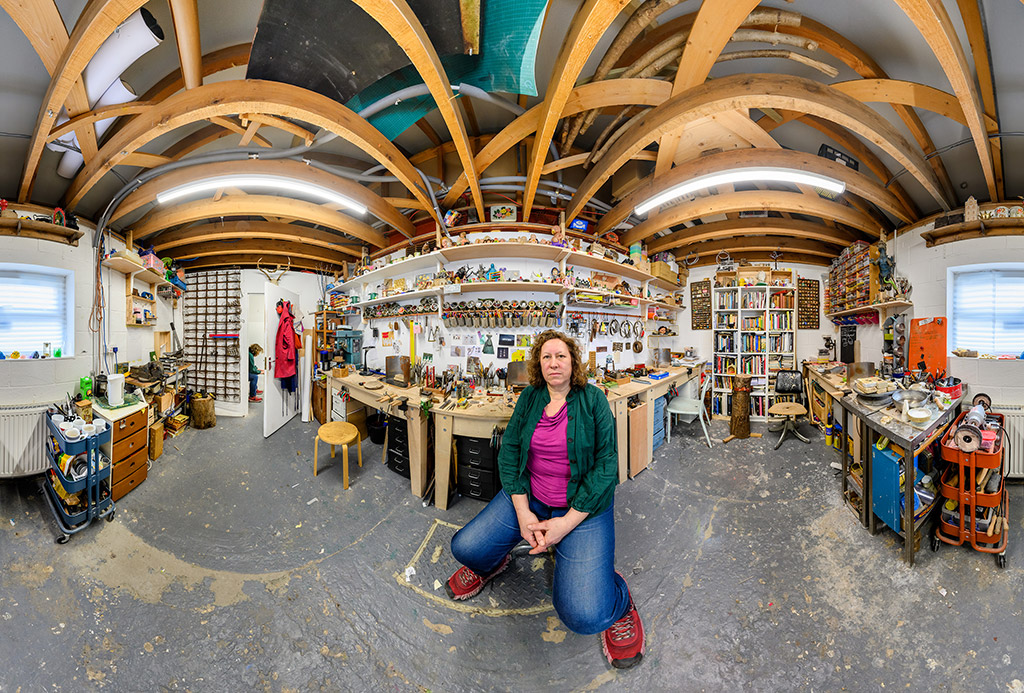 Woman sat on bench in workshop