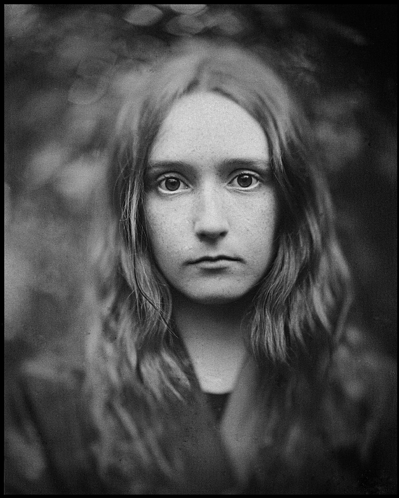 Black and white analogue portrait of a girl