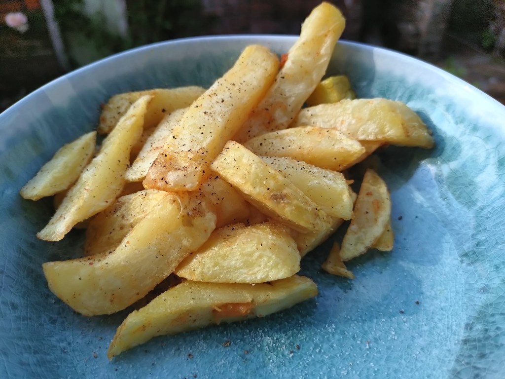 close up of a chips in a blue bowl. Photo Joshua Waller