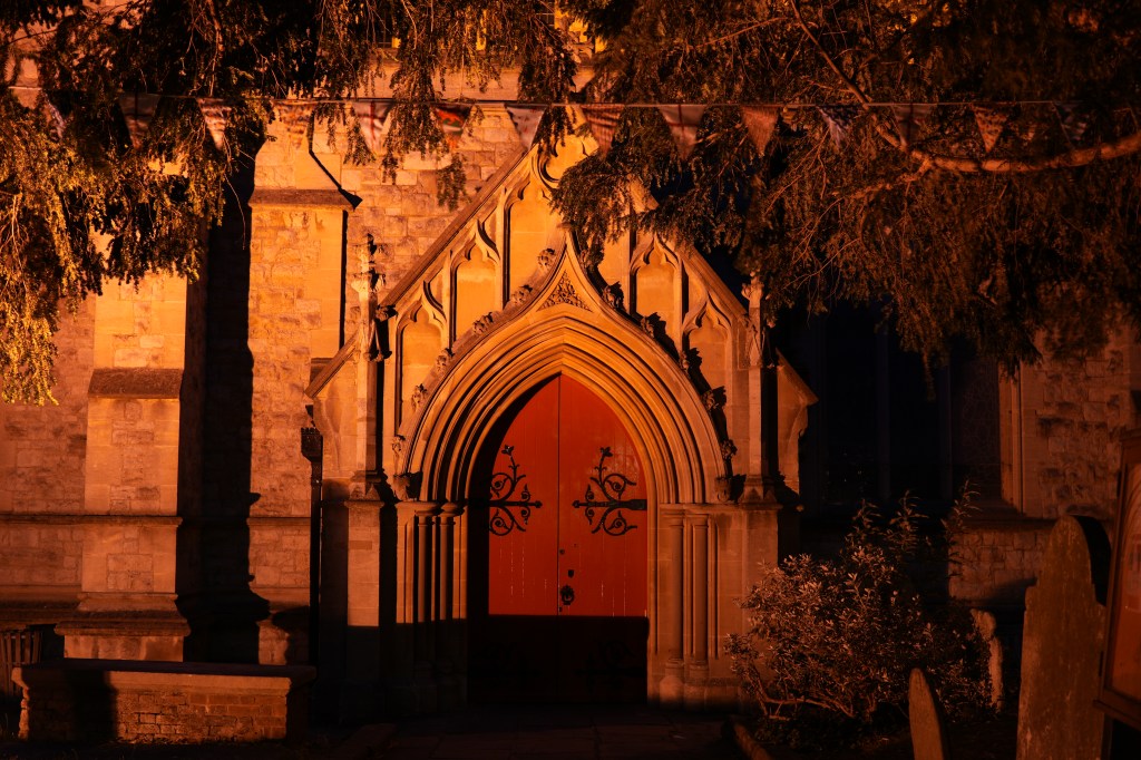 Sony Alpha A6700 image stabilisation example, 0.5sec hand-held exposure, church door at night illuminated by a yellowish light