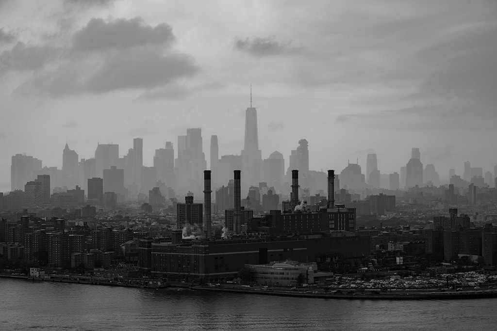 New York’s power station in the foregound set against the Manhattan skyline – including the Freedom Tower – in the background apoy architecture round
