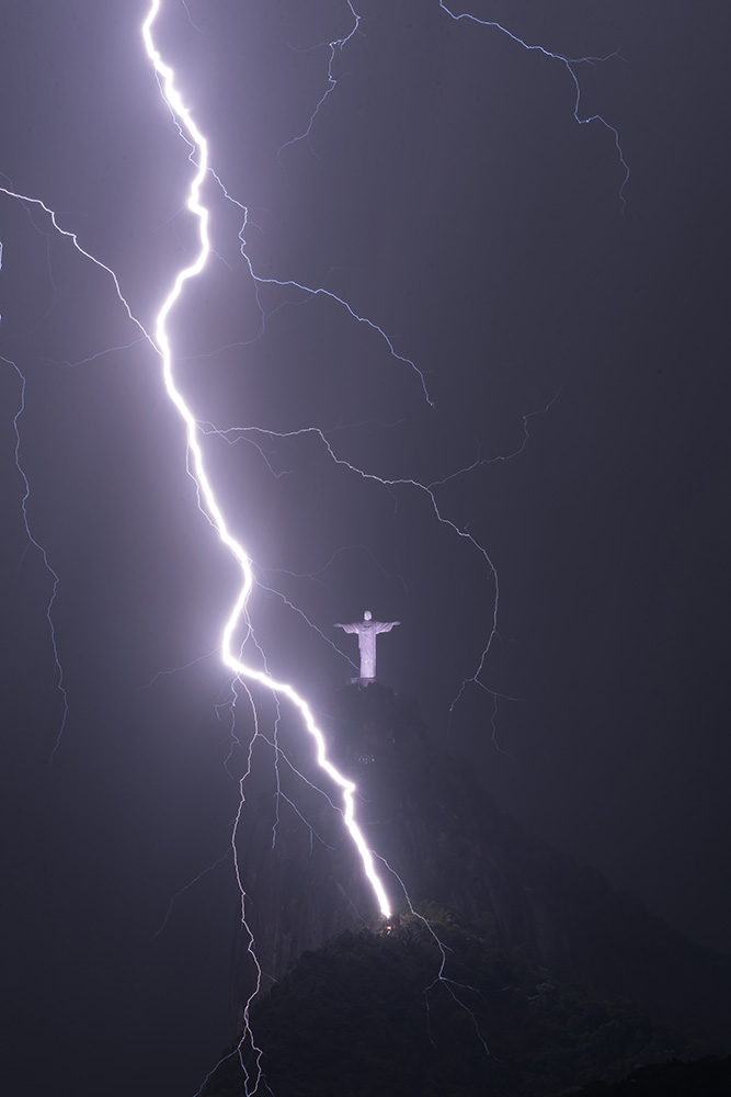 lightning bolt in rio de janiero in front of christ the redeemer statue