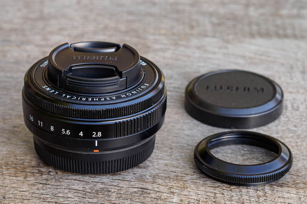 Fujifilm XF 27mm F2.8 R WR kit with caps and hood.