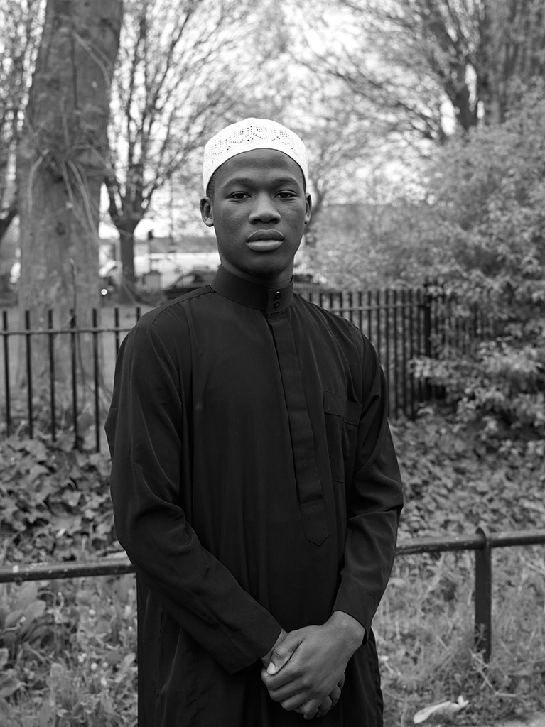Portrait of a young man who has just finished the Eid praying in the park © Mohamed Hassan