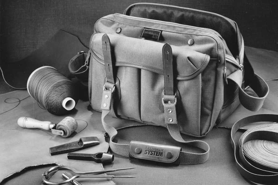 A product shot of a System 3 bag, circa 1979, next to some of the tools used to make it. © All images courtesy/copyright of Billingham unless stated