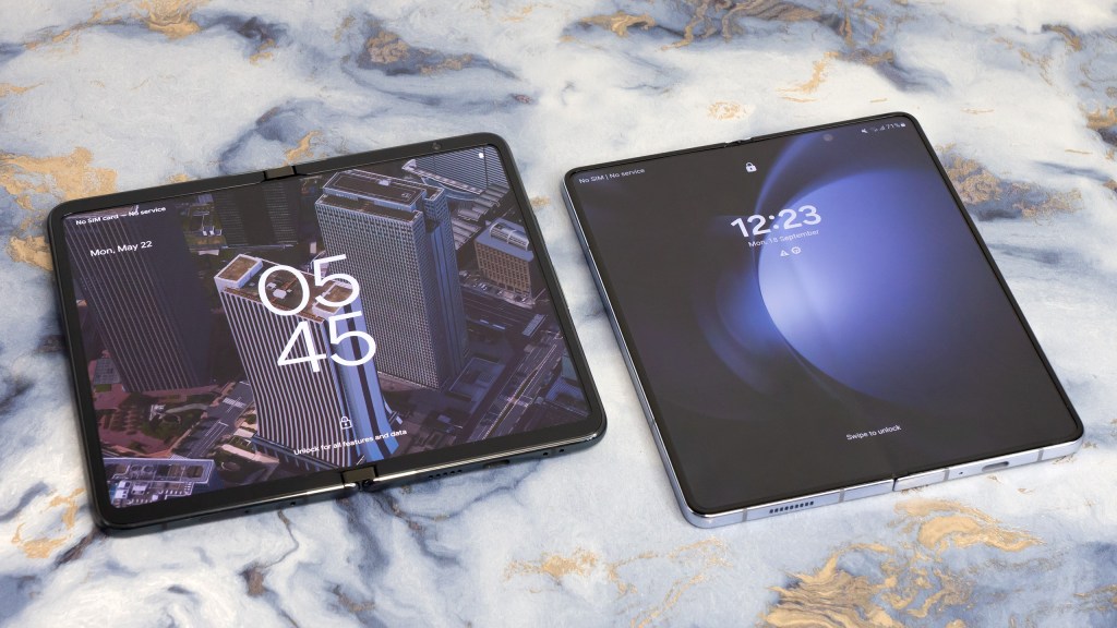 Google Pixel Fold (left), Samsung Galaxy Z Fold5 (right). Like the song, you've got to know when to fold them. Photo Joshua Waller / AP