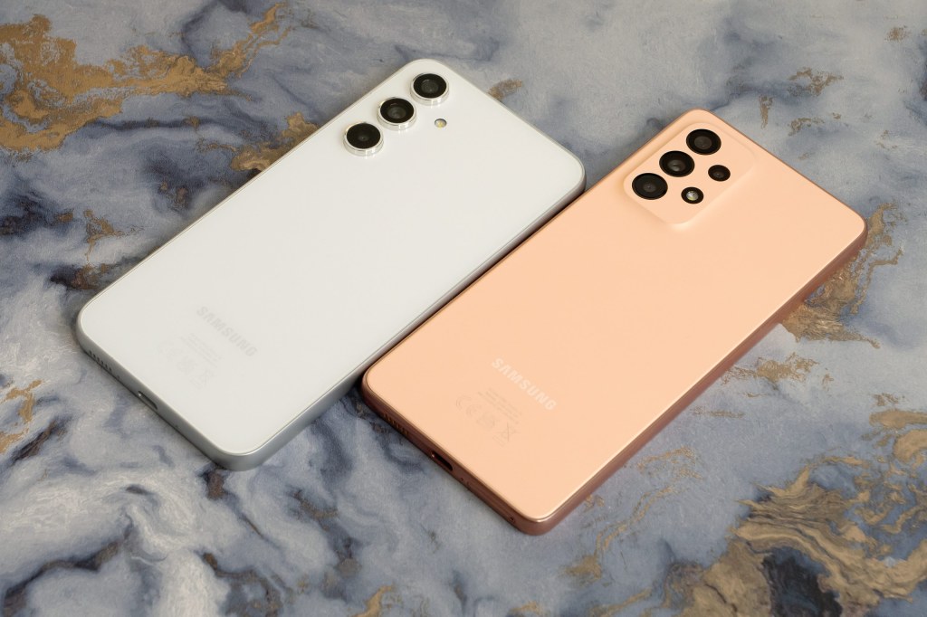 Samsung Galaxy A54 5G in white (left), with the Samsung Galaxy A53 5G in peach (right). Photo Joshua Waller / AP