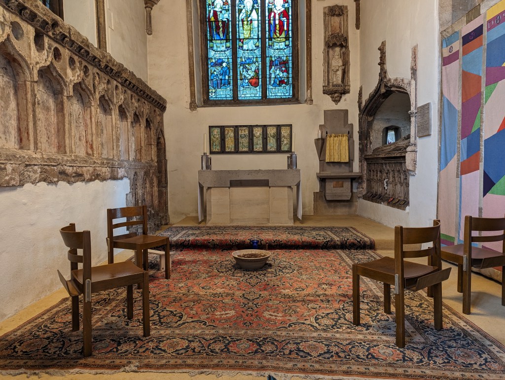 Google Pixel 7 Pro sample image church interior with four chairs and a colourful old rug