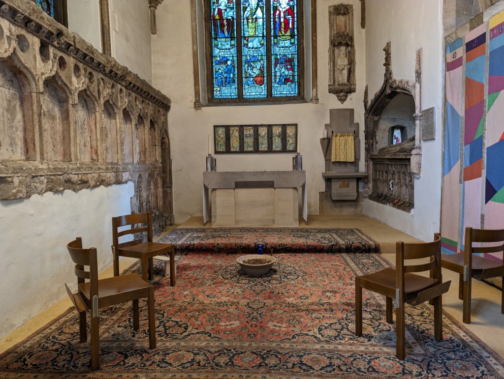 Google Pixel 8 Pro sample image, church interior with four wooden chairs on a colourful rug
