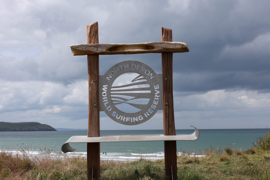 Canon RF 24-105 mm F4-7.1 IS STM lens sample image, a sign on the coast saying "North Devon World Surfing Reserve"