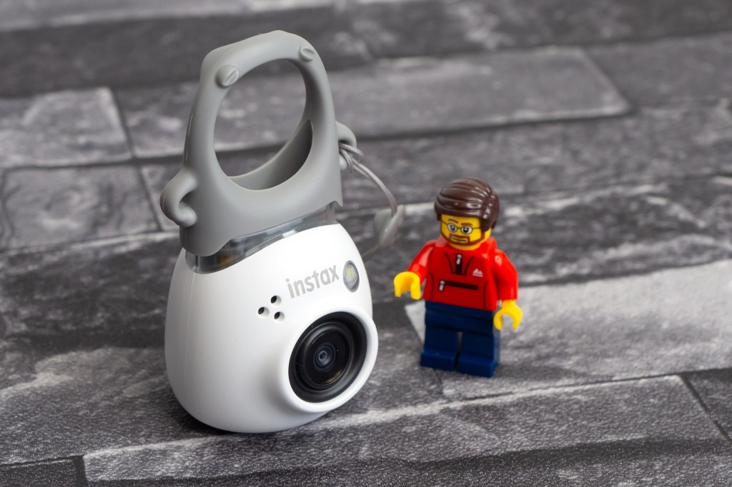 Instax Pal in white, shown with viewfinder "hat". Photo JW/AP