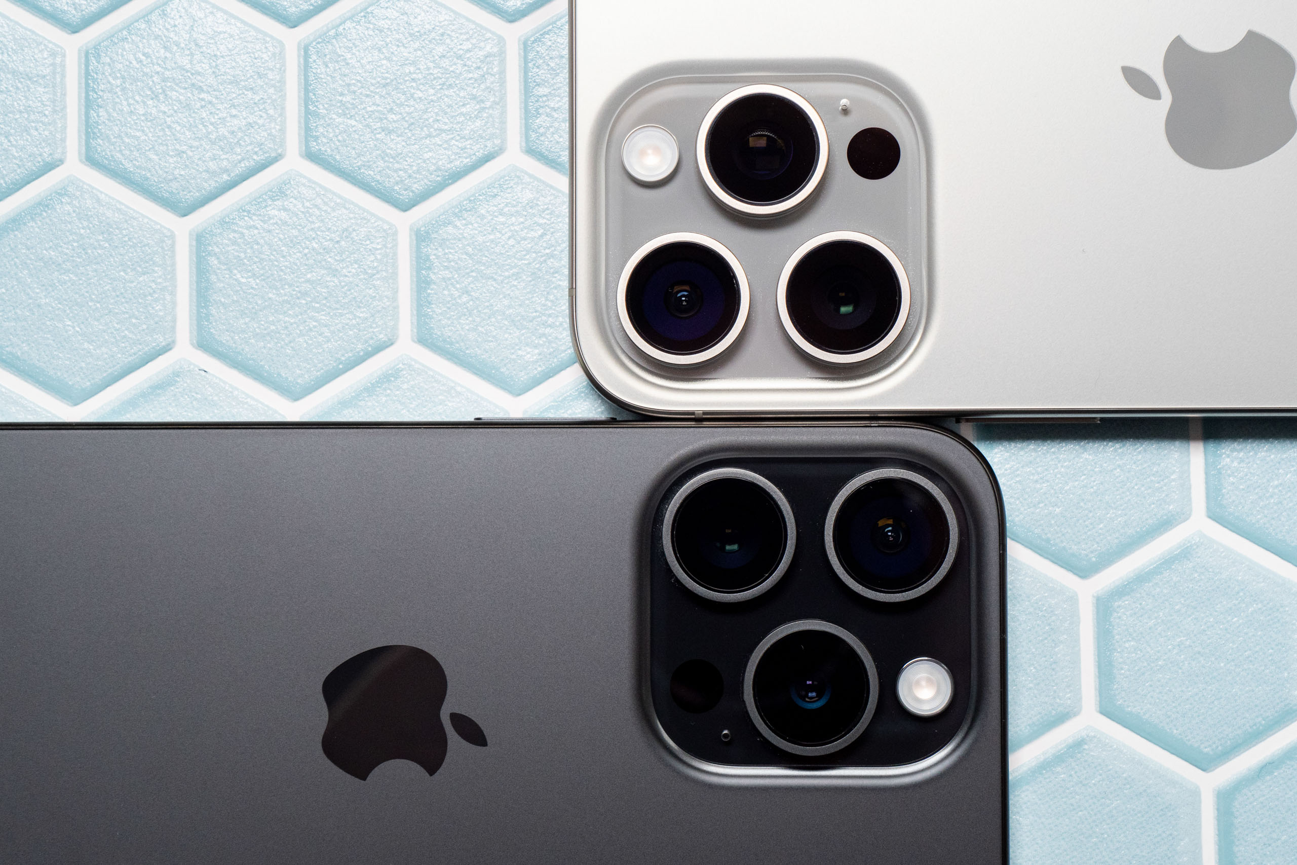 Close up of iPhone 15 Pro Max and iPhone 15 Pro cameras side by side