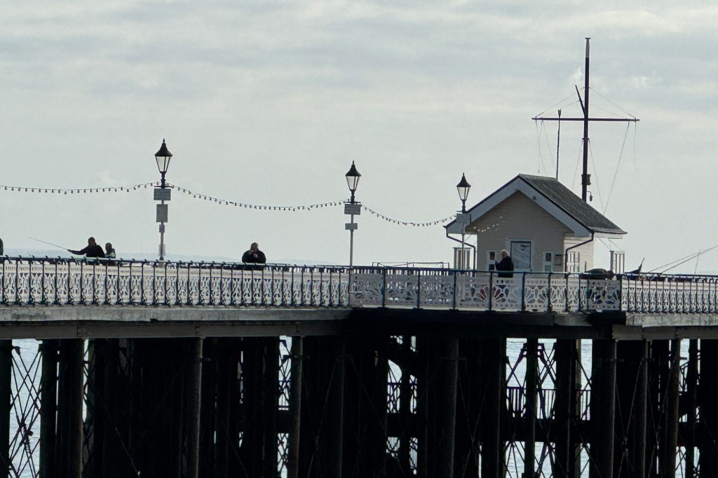iPhone 15 Pro 10x zoom sample image, pier with a small house