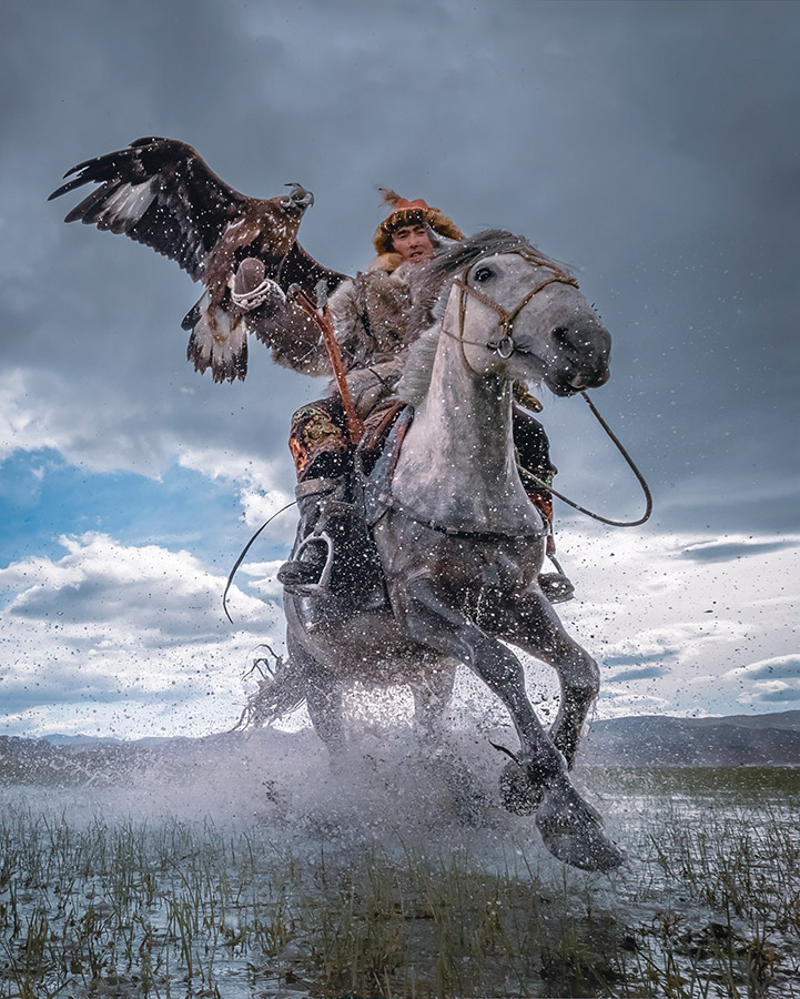 The Eagle Hunters of western Mongolia practice an age old tradition, working in unison with their horses and golden eagles to hunt for foxes and hare in the cold vast landscapes of the country. second place action round of apoy 2023