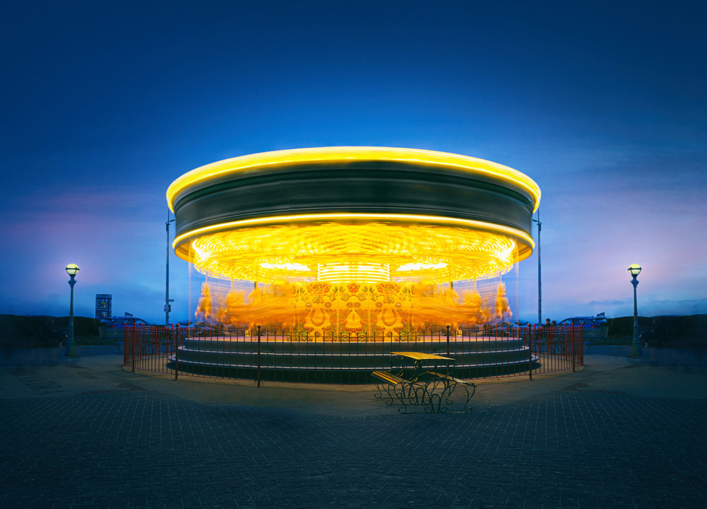 night funfair scene long exposure of merry go round