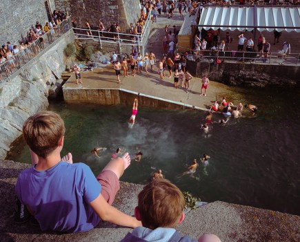 people jumping into water in plymouth