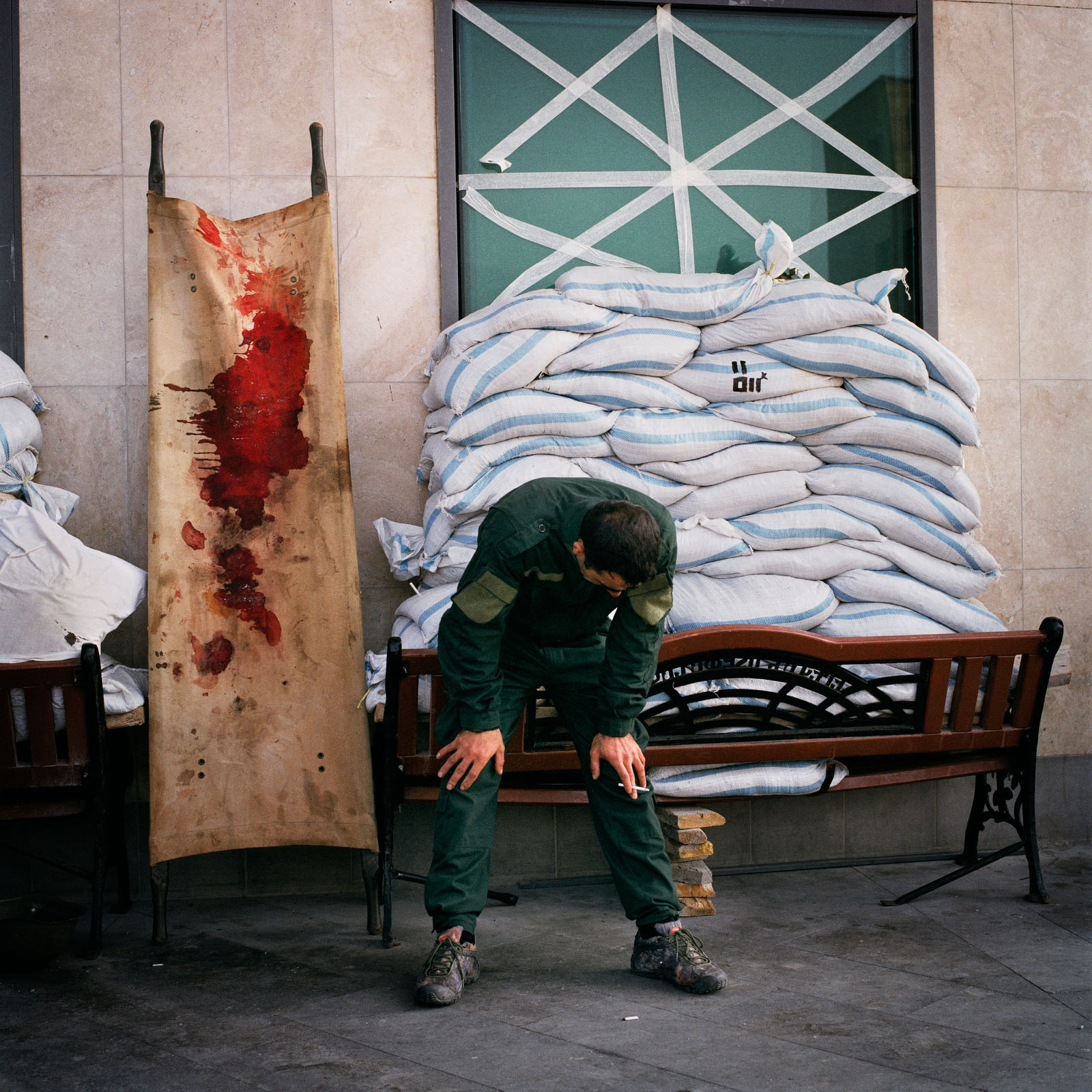 A man weeps beside a bloodied stretcher outside the emergency department of the Republican Medical Centre in Stepanakert.