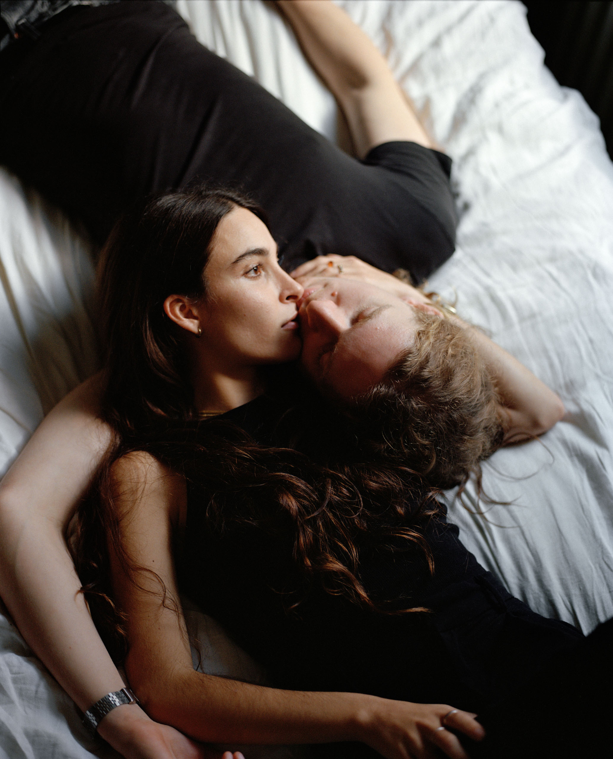 A couple lying on a bed