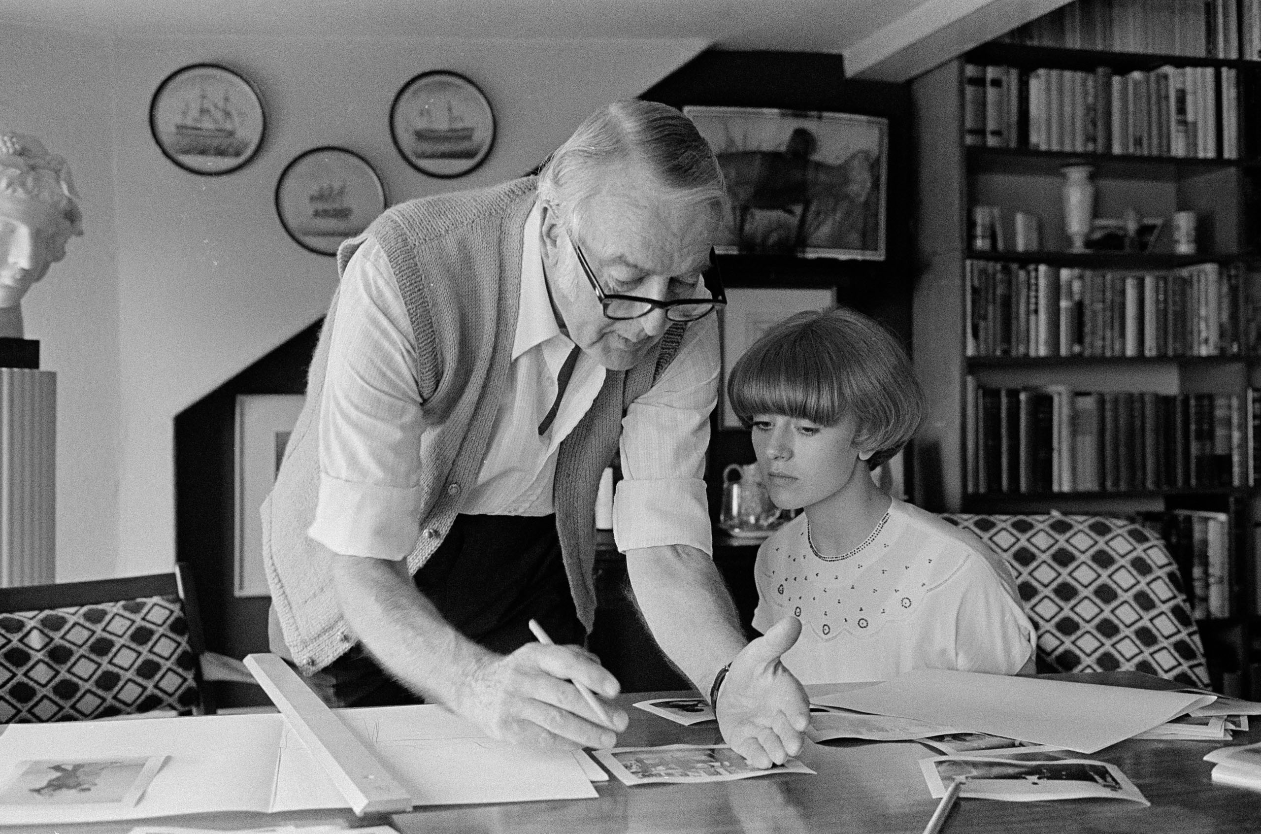 Tom Hopkinson helps Sue Packer with a layout at his home in Penarth, Wales