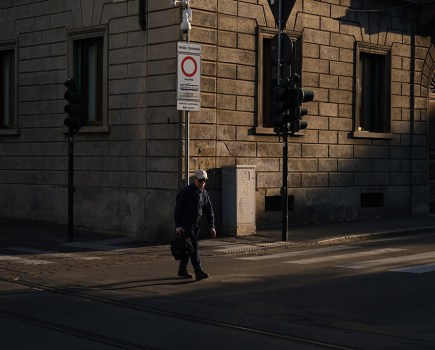 man walking the street of Florence early morning, use of chiaroscuro. Looking at art will make you a better photographer