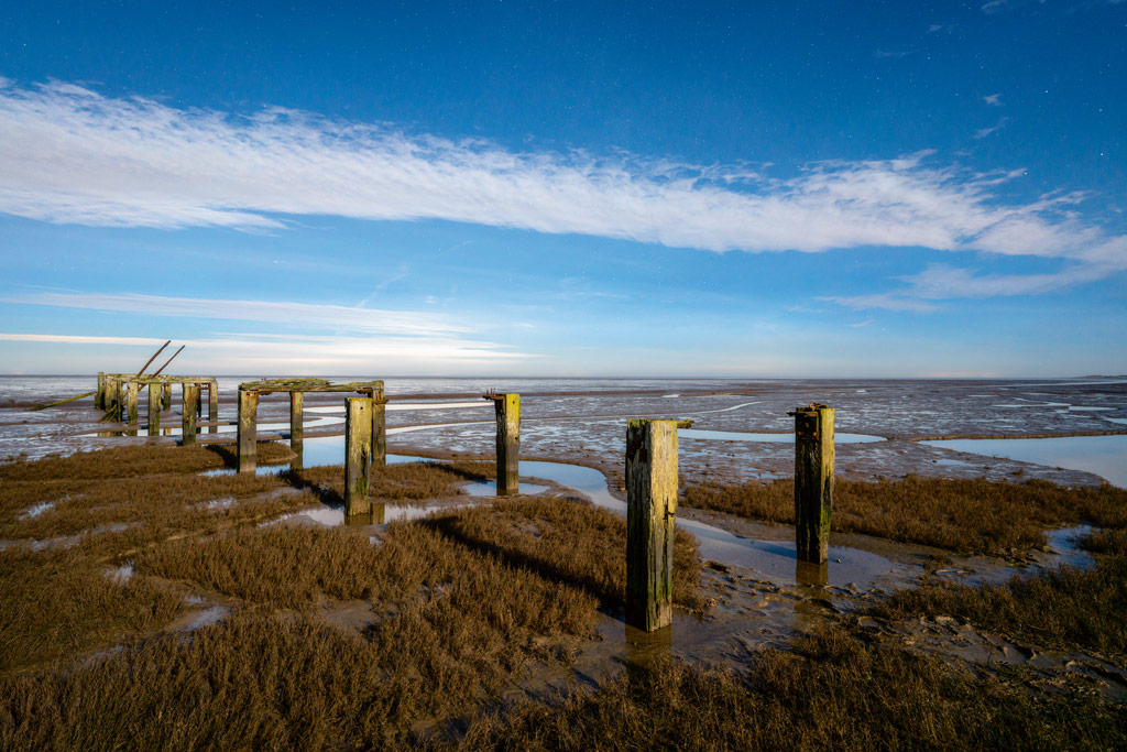 Moonlight landscape, The derelict jetty at Snettisham Beach photographed at night under a full moon. Image: James Abbott