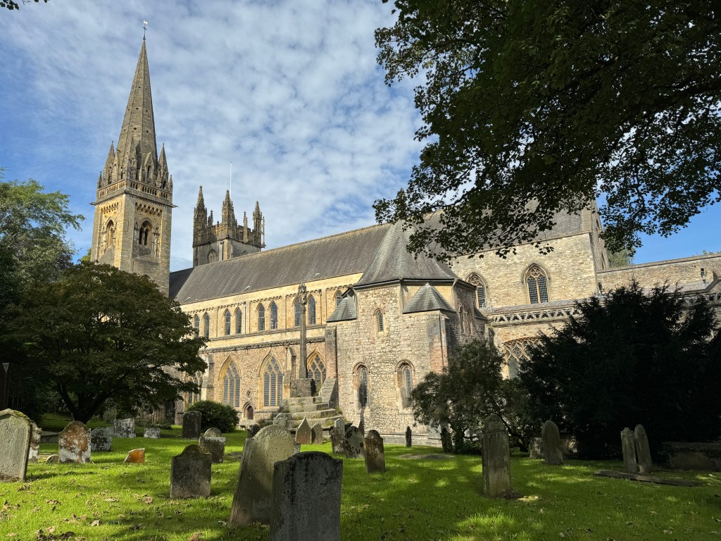 iPhone 15 Pro 1x lens sample image, a cathedral with trees and graves