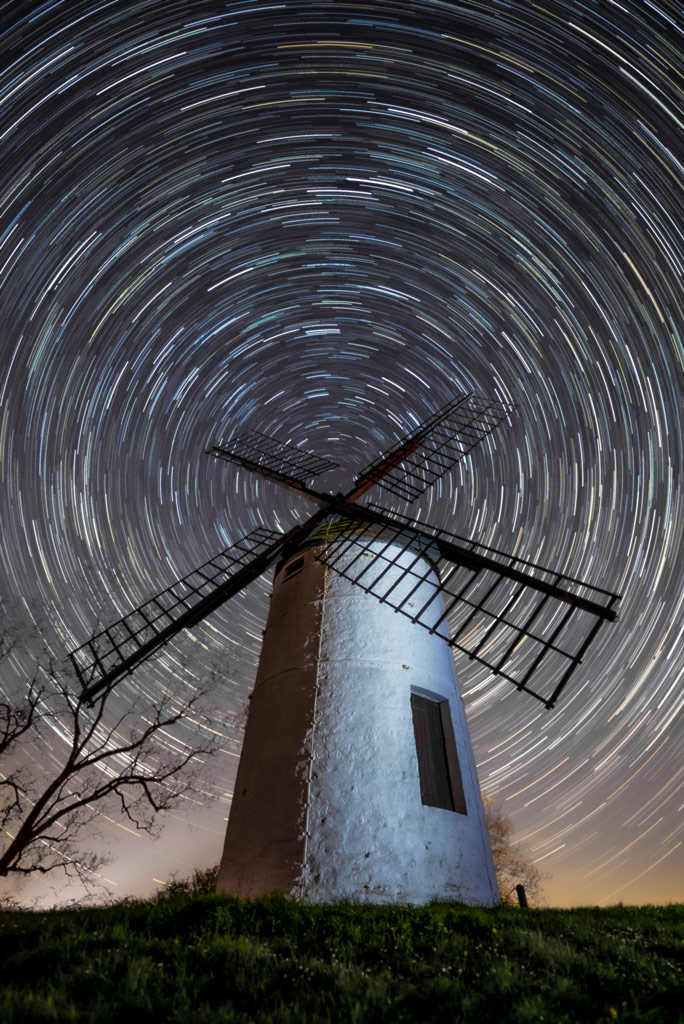 Ashton Windmill with full circle star trails centered at the middle of the windmill's spades
