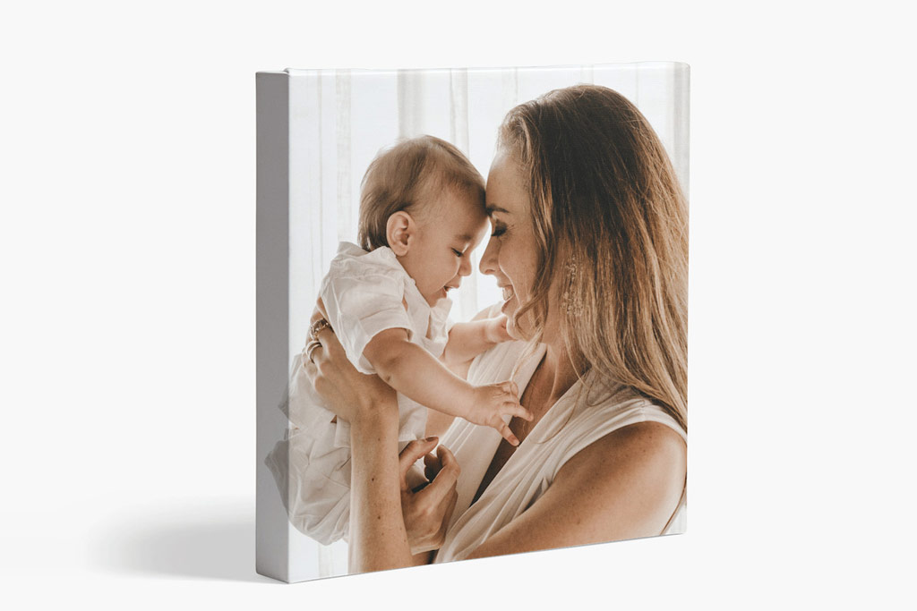 Vista Print printing service canvas print example, square format canvas with an image of a woman holding a baby