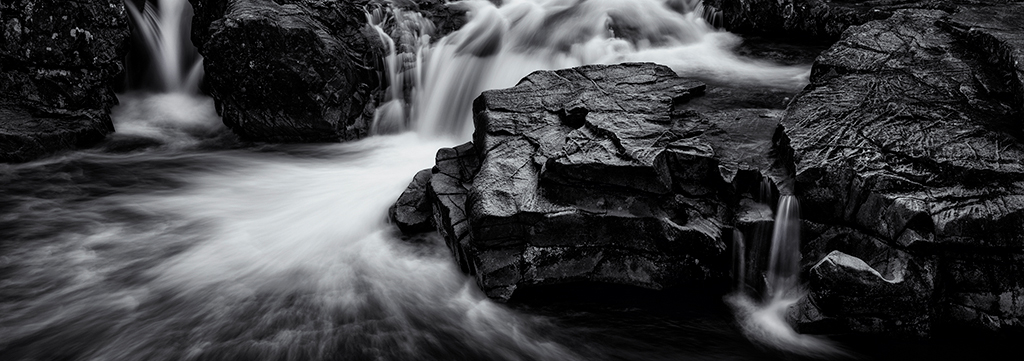 Leica M11 sample image: long exposure black and white image of a small waterfall
