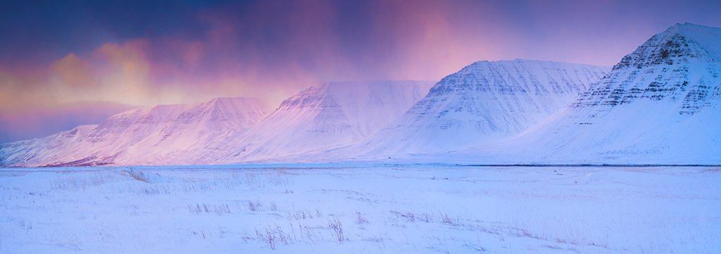 Leica M11 sample image: Snowy landscape in Iceland, with a purple and orange misty sunrise