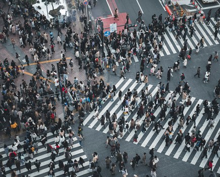 taken from above very busy crossing as hundred of people cross the road