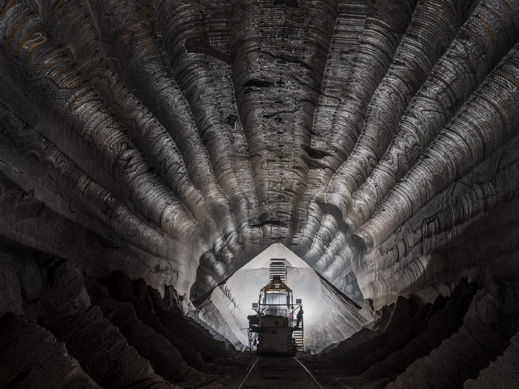 Edward Burtynsky Uralkali Potash mine shaft interior in black and white with machinery in the middle