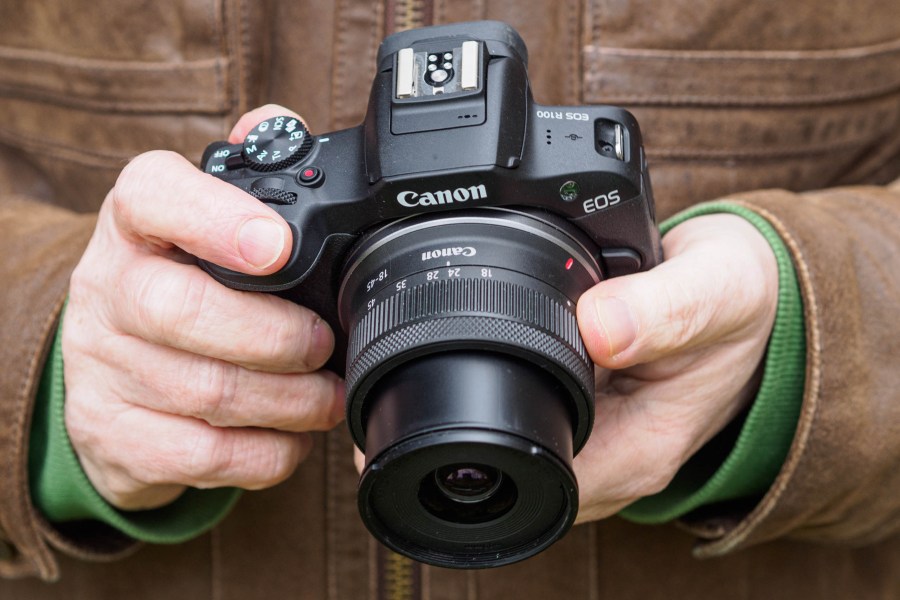 Canon EOS R100 in-hand