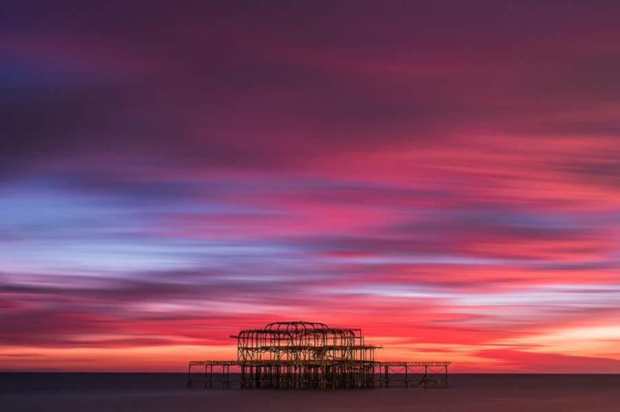 Fiery sunset Skies Over the West Pier by Michael Steven Harris
