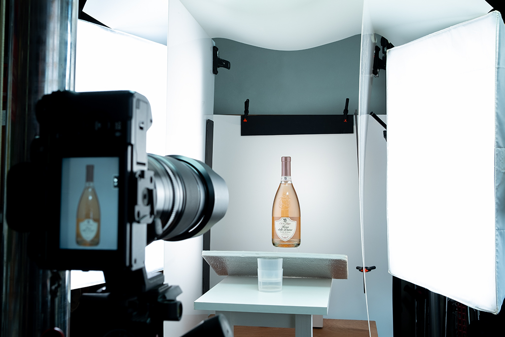 Product photography studio set up with a bottle of rose wine