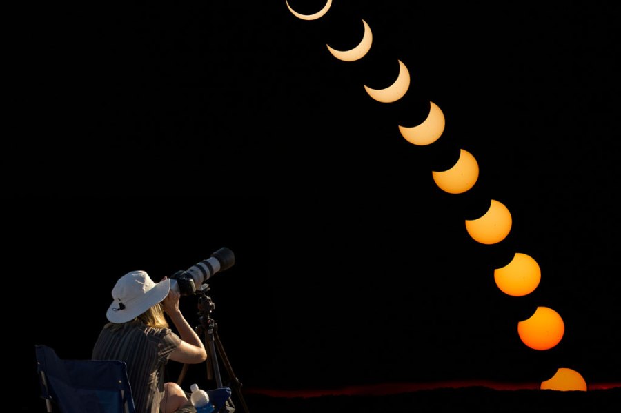 Photographer taking photos of an eclipse