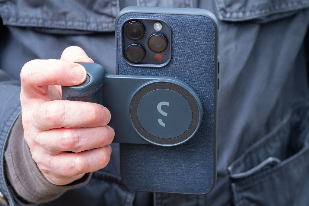 ShiftCam SnapGrip in use on iPhone 15 Pro Max with Peak Design case in portrait orientation 