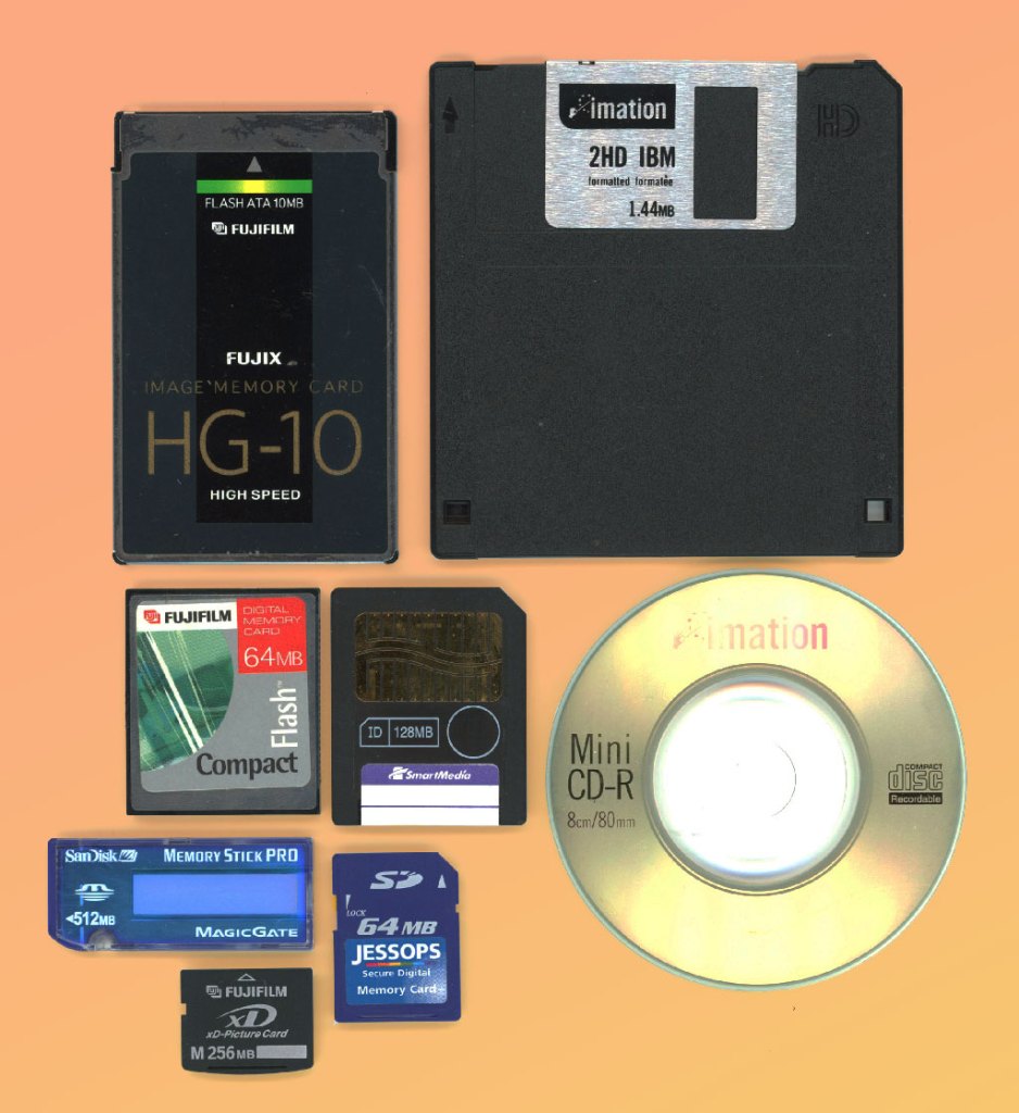 Old storage solutions for images, floppy disc, CD, and various SD cards