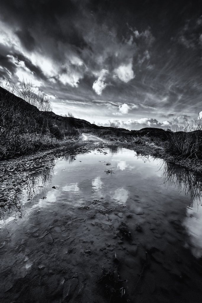 Smartphone landscape photography, black and white landscape with clods reflecting on a lake