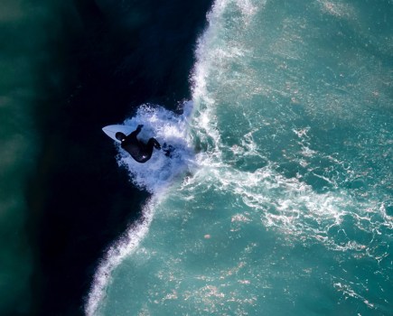 shades of surfing by scott fisher, view of surfer overhead using a drone