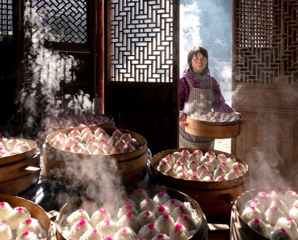 Chinese photographer Zhonghua Yang has been crowned Overall Winner of Pink Lady® Food Photographer of the Year 2024 and awarded the prize of £5,000 (GBP) for his image Red Bean Paste Balls. The photo captures a woman entering a room to add her latest creation to a mountain of steaming dim sum, all prepared for a feast to celebrate Lunar New Year.