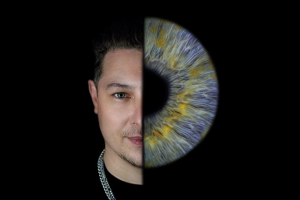 portrait of a young man split with image of his iris