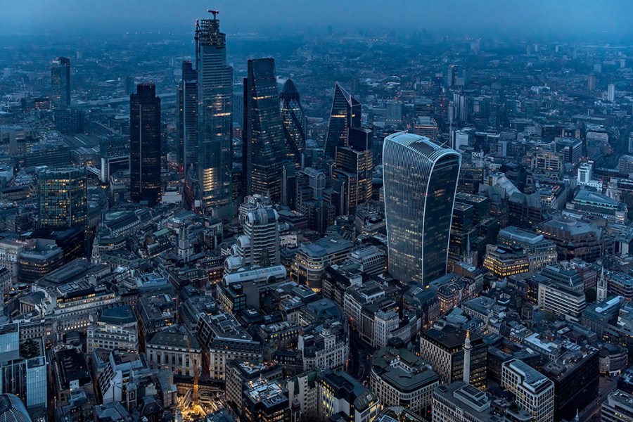 aerial photography of london skyscrapers at night with lights on
