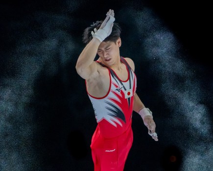 Japanese Gymnast Daiki Hashimoto at the Bars capture mid air by Eric T'Kindt winner of world sports phoography awards 2024